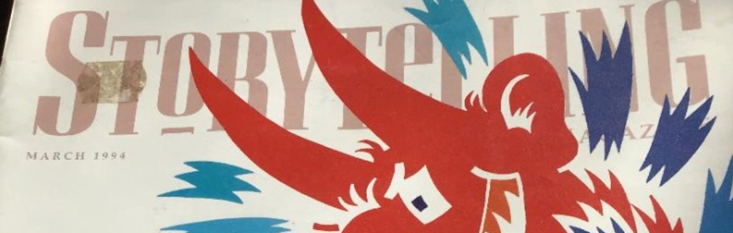 image of a red bird on a book cover with 'storytelling' in the background.